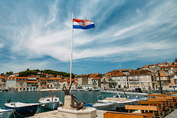 istock Croatian Flag and Traditional Harbor View, Brac 2220292335