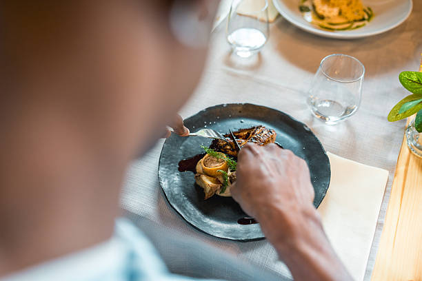 istock Elegant Plating Of Gourmet Dish On Textured Slate Plate In Upscale Restaurant Setting 2220292667