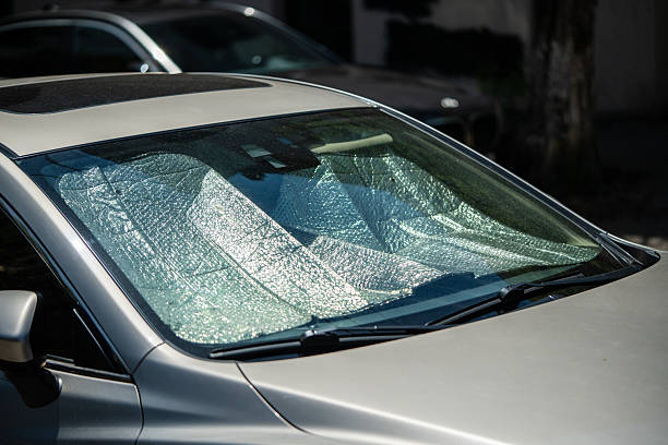 istock Protective reflective surface under windshield of passenger car parked on hot day. Summertime 2220293451