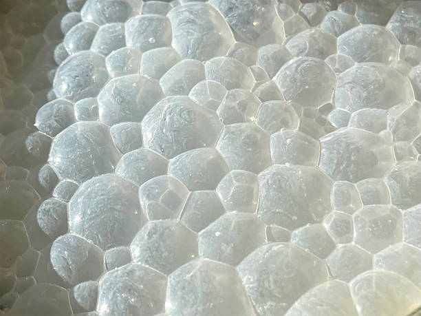 istock Macro View of Soap Foam Voronoi Bubbles with Sunlit Details 2220294618