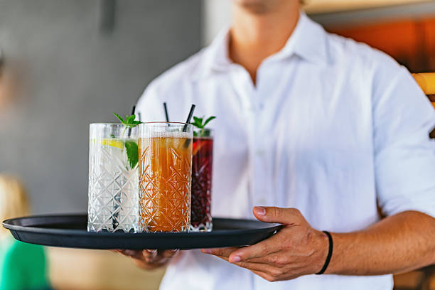 istock Waiter Serving Refreshing Non-Alcoholic Cocktails 2220301325