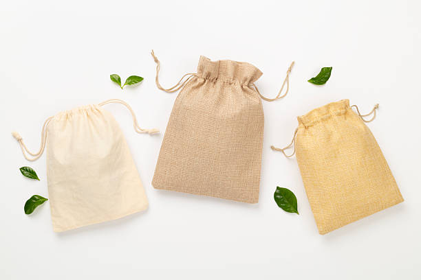 istock Small eco sacks on color background, top view 2220301652