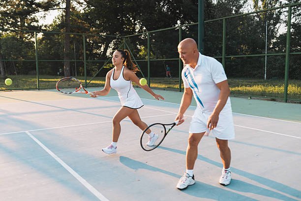 istock Coach Giving Game Tips During Tennis Practice 2220305961