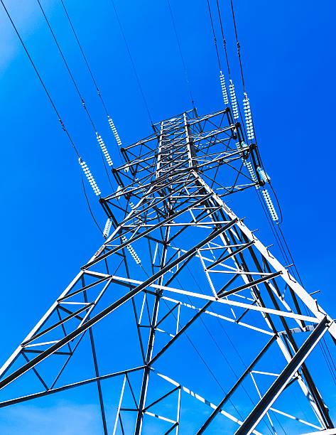 istock High Voltage Transmission Tower Against Blue Sky 2220307381