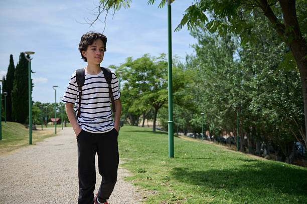 Outdoor portrait of a biracial Chinese and Caucasian boy.