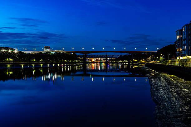 Early morning fog city lights reflections River Wey bridge Guildford Surrey England Europe