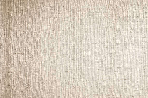 istock Brown sackcloth woven texture background in natural pattern. Jute hessian burlap, linen background in light beige cream color blank. Weaving canvas fiber line cotton cloth textured as organic. 2220319069