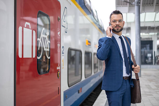 istock Young businessman commuting and talking on his phone 2220319196