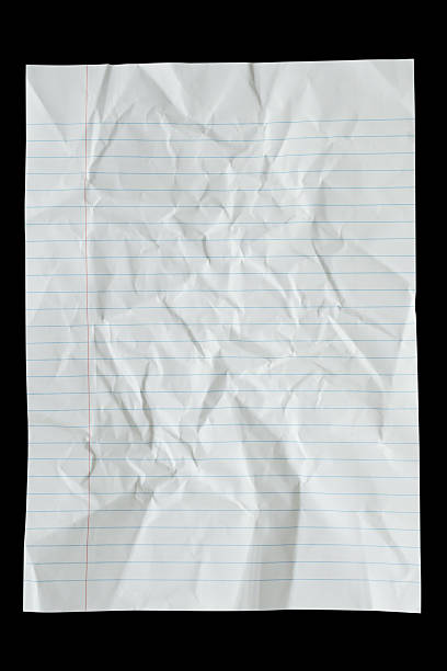 istock crumpled lined paper isolated on black background 2220319310