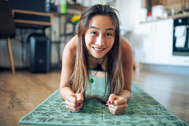 istock Happy asian woman practing pilates at home. 2220319728