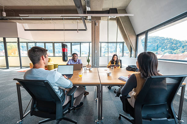 istock Diverse Team of Entrepreneurs at Work in Coworking Space 2220320035