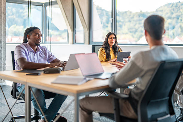 istock Diverse Entrepreneurs Engaged in Coworking Space 2220320037
