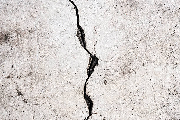 istock Grunge cracked concrete wall texture abstract background 2220323087