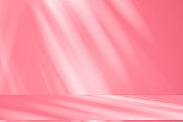 istock Wall interior background, studio, and backdrops show products. with shadow from window color white and pink light. background for text insertion and presentation of product 2220325484