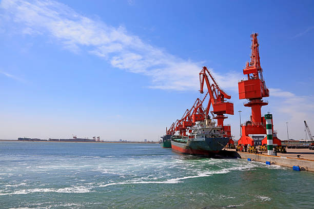 istock Portal crane and Cargo ship 2220335026