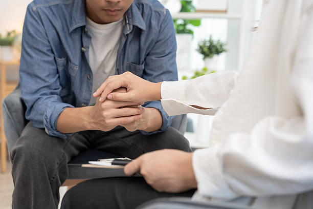 istock psychiatrist hold hand support each while discussing family issues. doctor encourages and empathy woman suffers depression. psychological, save divorce, Hand in hand together, trust, care 2220339111