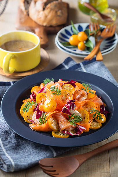 Marinated salmon salad with kumquats and carrots