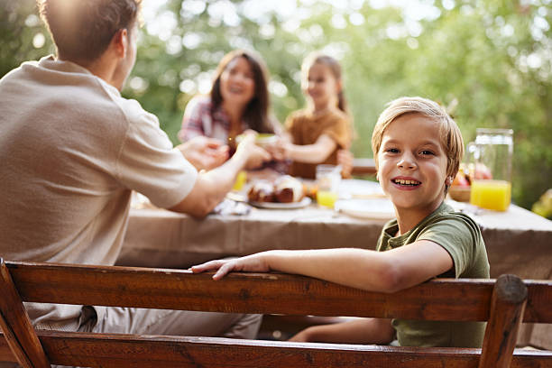 High angle view of happy multi-generation family enjoying in lunch on a patio. Copy space.