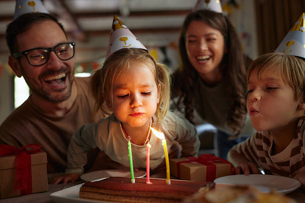istock Blowing Birthday candles on a cake! 2220344469
