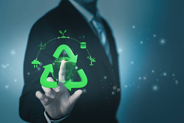 istock Businessman use smart technology, green sustainability icon and globe, symbolizing AI-driven recycling, eco-friendly ESG practice, circular economy, sustainable business environmental tech innovation. 2220344686