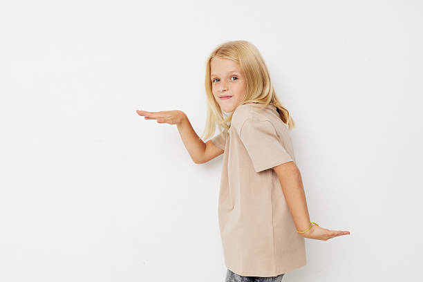 istock happy child with blond hair on a light background 2220346370