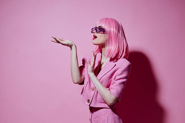 istock Portrait of a charming lady gestures with his hands with a pink jacket unaltered 2220347941
