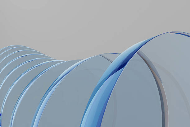 A blue and white spiral with a grey background. The spiral is made of glass. The spiral is curved and has a lot of detail