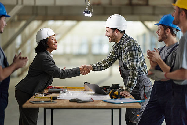 istock Successful deal between female architect and manual worker! 2220350815