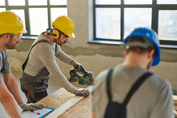 istock Male carpenters working on a wood at construction site. 2220350952
