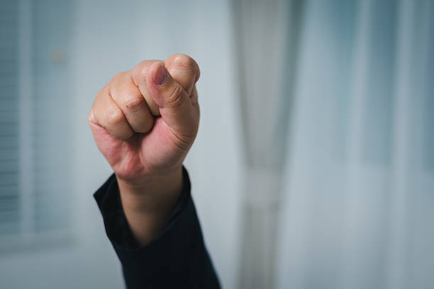 A business hand gesture illustrates negotiation dynamics a modern office setting.