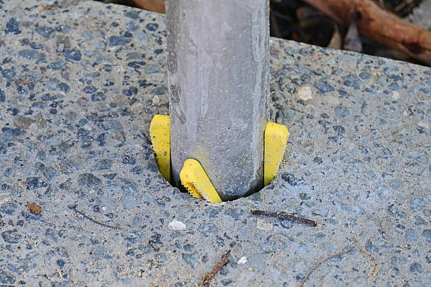 istock The base of a metal fence post 2220355359