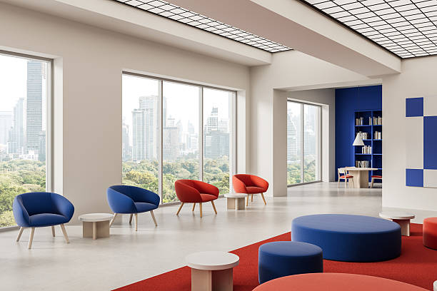 istock Modern interior lounge with colorful seating and city view through large windows in bright open space with minimalistic design and geometric ceiling lights. 3D Rendering 2220355473