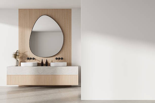 istock Modern bathroom interior with wooden paneling, dual sinks, abstract mirror and large empty white wall for poster or branding mockup template backdrop. 3D Rendering 2220355609