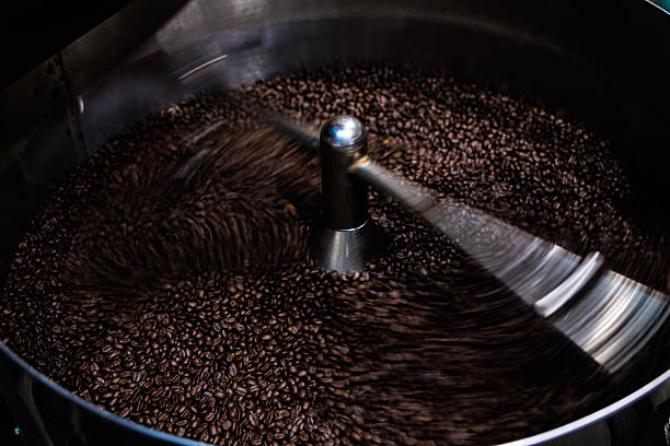 istock fresh coffee beans roasted spinning cover professional machine to soft focus slow shutter speed want to make motion blur of coffee beans detail, 2220365110