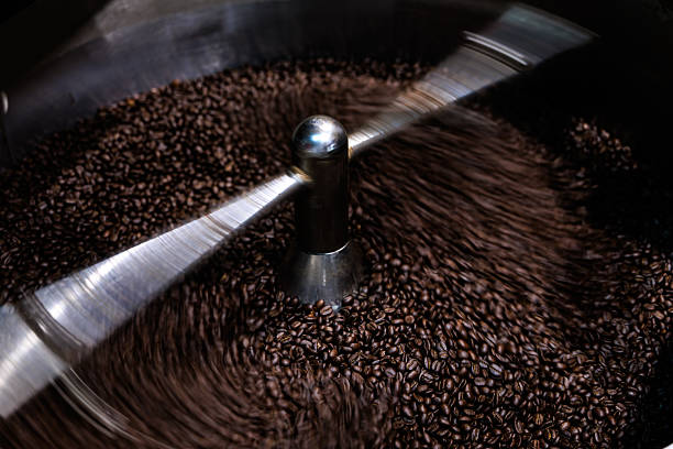 istock fresh coffee beans roasted spinning cover professional machine to soft focus slow shutter speed want to make motion blur of coffee beans detail, 2220365111