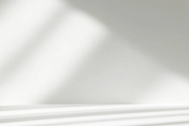 istock Abstract white studio background with shadows of window. Empty 3d room. Display product with blurred backdrop. 2220367406