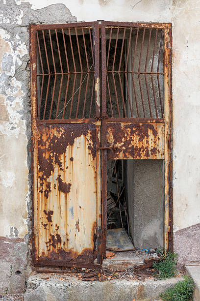 istock Front view of a rusty metallic door on the Lipari Island 2220367959