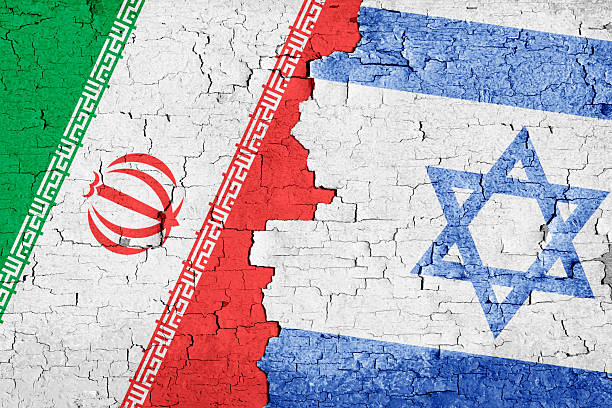 istock Israel and Iran Flags Together on Cracked Wall 2220368848