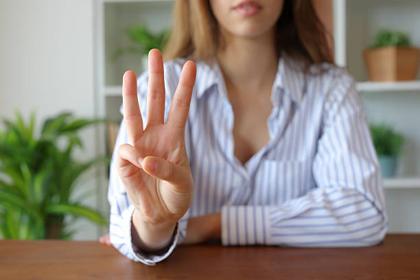 istock Woman hand at home gesturing number three 2220369922