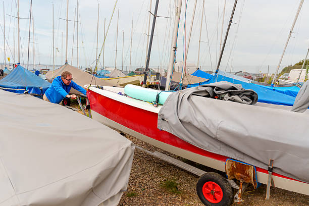 istock Senior couple Preparing his boat for a sailing race 2220371902