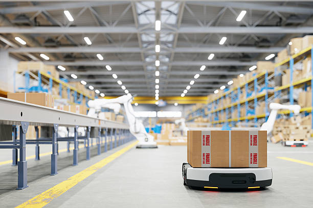 istock Smart Warehouse With Automated Guided Vehicles Carrying Packages And Robots Working On Conveyor Belt 2220376051