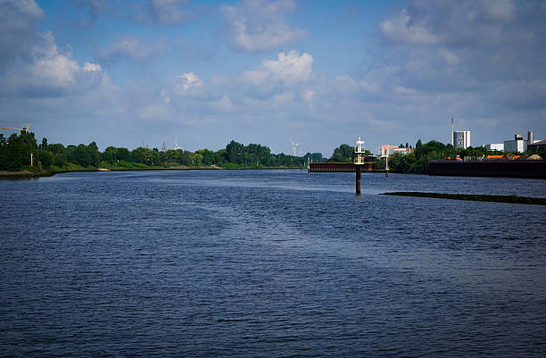 istock A wide river with trees along the banks and a tranquil atmosphere. 2220376245