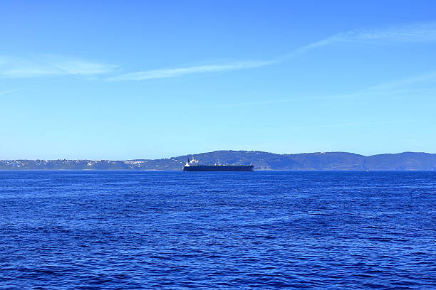 istock container ships on Strait of Gibraltar with morocco mountains in background 2220376317