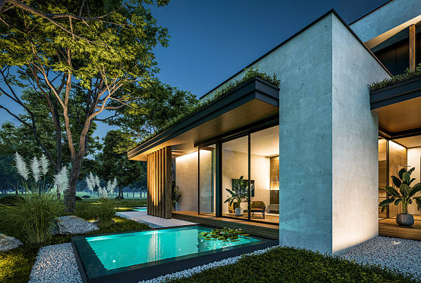 istock 3d rendering of two-story house with concrete facade in night 2220376853