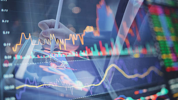 istock hands analyzing ai-powered trading chart on digital tablet with live stock data and crypto volatility tracking analytics dashboard on touchscreen showing stock index changes and ai market forecasting 2026 2220378724