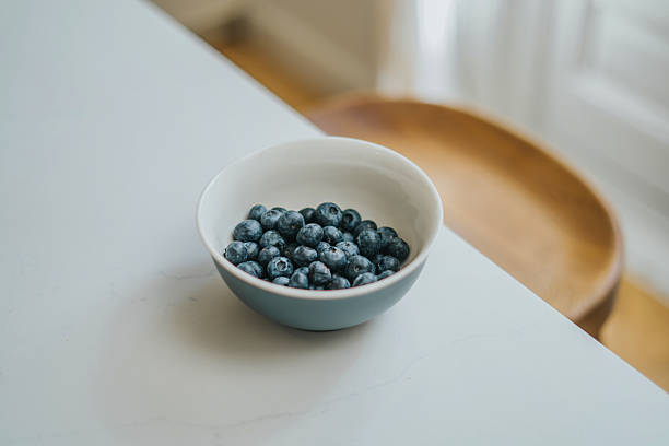 istock Blueberries ripe in blue bowl 2220385320