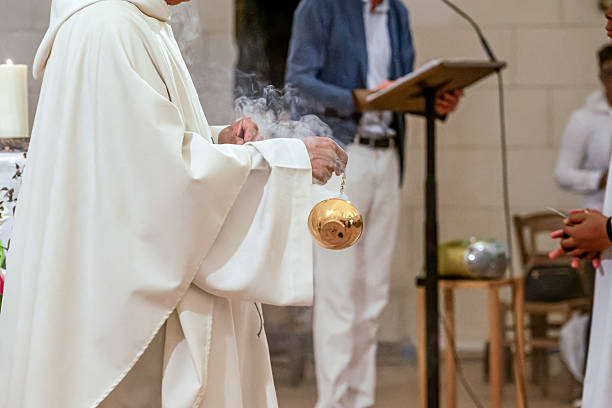 istock Catholic priest using censer during baptism or communion ceremony 2220386822