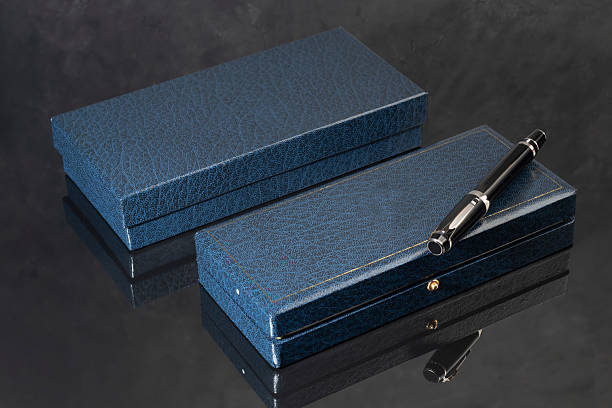 Branded pen in a box. Gift set. Selective focus. Office interior. Copy space