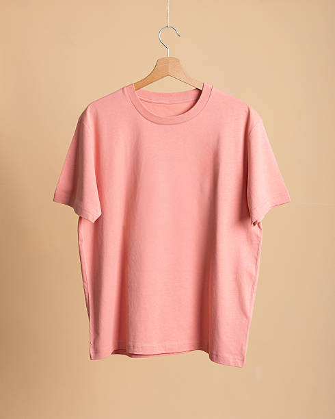 istock Pink Cotton T-shirt on Neutral Background 2220387514