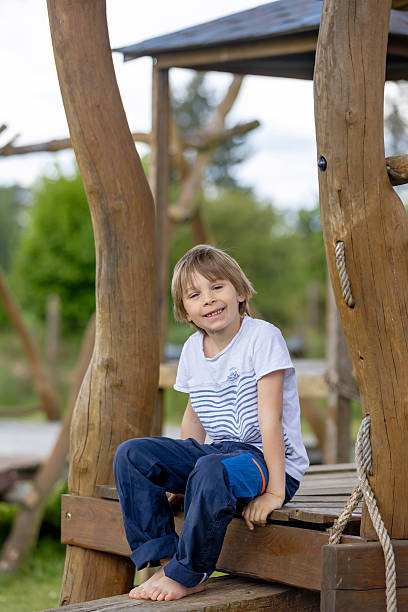 istock Child, playing on playground springtime, enjoying nice weather 2220387601